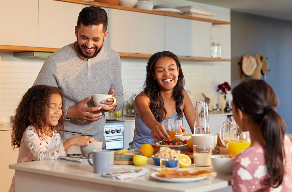 Family enjoying breakfast at home, representing homeowners insurance protection from Amtex Insurance.